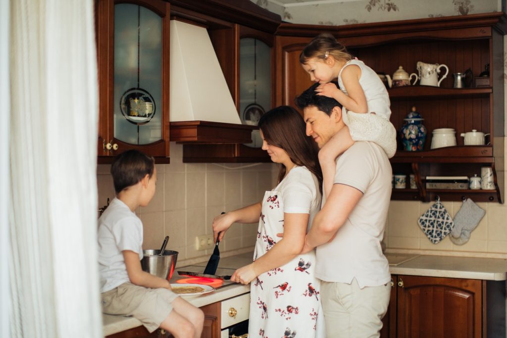 family making breakfast together