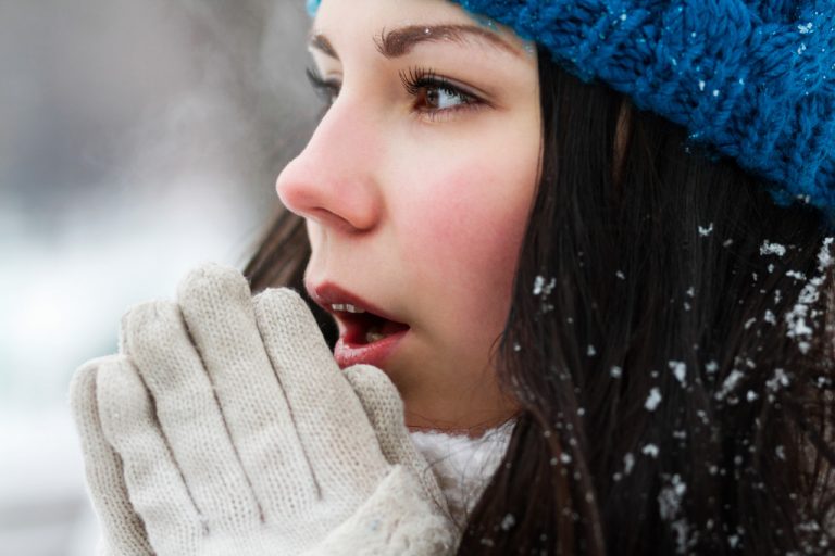 a woman wearing winter clothes