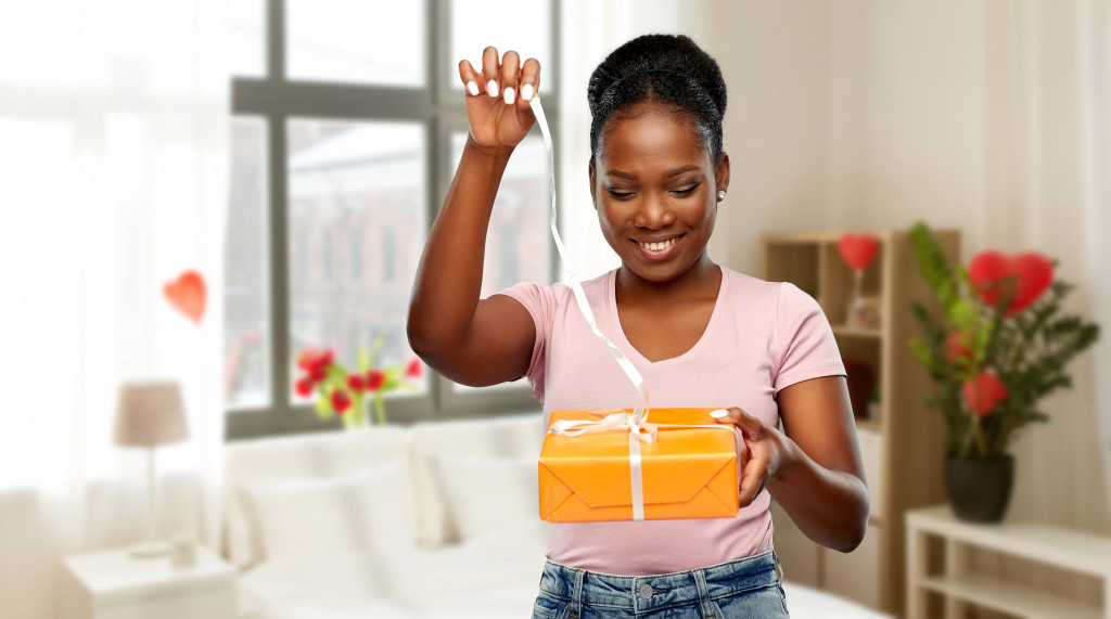 woman opening a gift