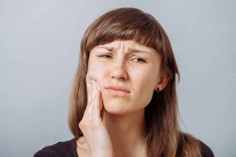 a woman with painful gums