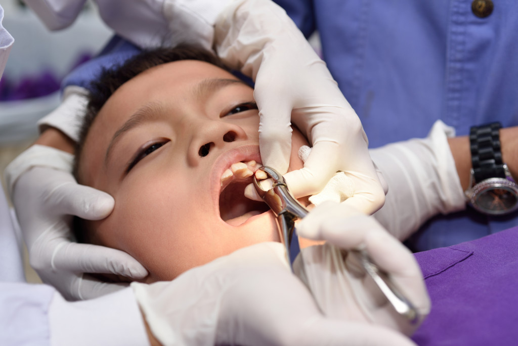 Portrait of a child getting periodontal treatment