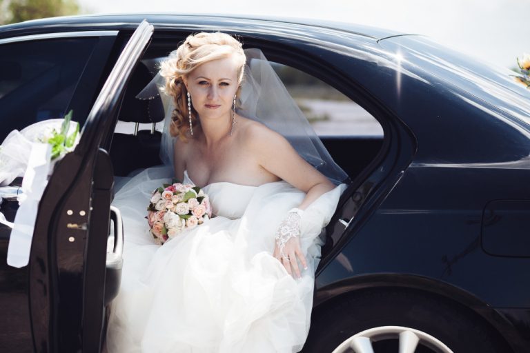 bride getting out of a car