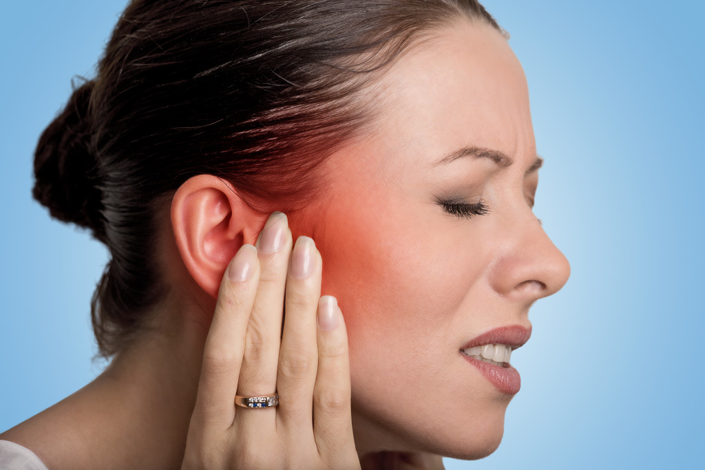 woman having a painful ear